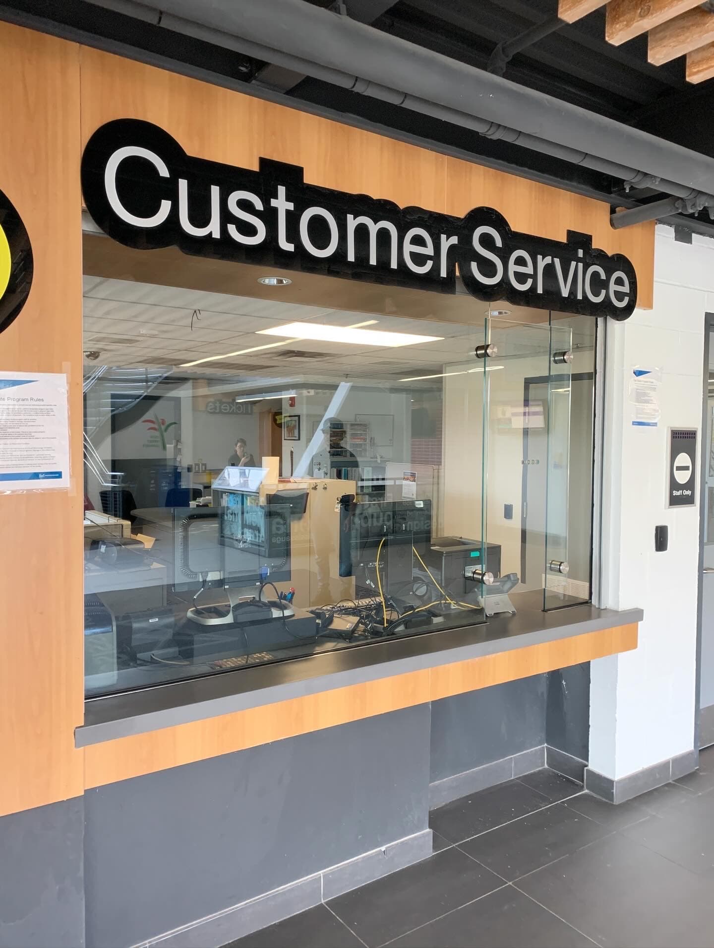Glass-front customer service window installation in a commercial building